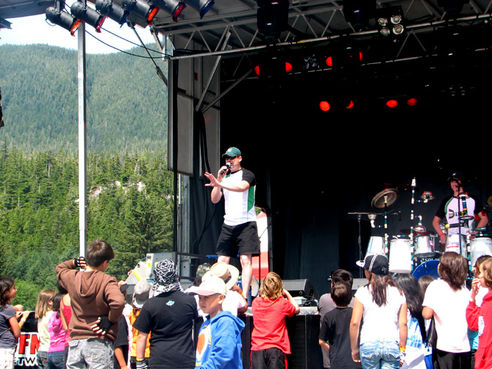 Junkyard Symphony takes the stage. The kids come up immediately.